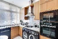 well-equipped kitchen in paris luxury apartment