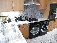 well-equipped kitchen in paris luxury apartment