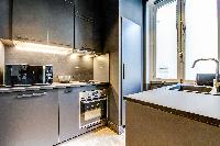 modern kitchen of Champs Elysées - Foch - 1 Bedroom luxury apartment