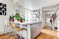 sleek breakfast bar and stools in a Paris luxury apartment