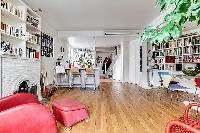 2 bedroom Paris luxury apartment with its original hardwood floors, open floor concept, and mid-cent