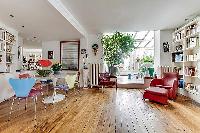 2 bedroom Paris luxury apartment with its original hardwood floors, open floor concept, and mid-cent