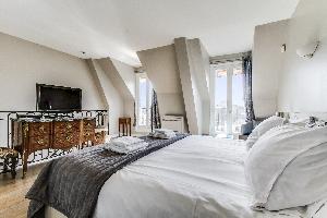 clean bedroom linens in Champs Elysées - Matignon Penthouse luxury apartment