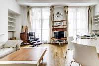 lovely dining area and living area with double-glazed windows in a 2-bedroom Paris luxury apartment