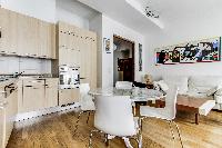 lovely dining area, kitchen and living area in a 2-bedroom Paris luxury apartment