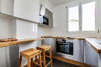 cool kitchen with breakfast nook in Trocadero - Longchamps luxury apartment