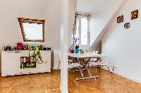 bright dining area with eaves wall, stylish dining table and chairs