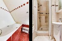 1 bathroom with bathtub and 1 with shower area in a 2-bedroom Paris apartment