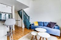 living area with comfortable blue sofa