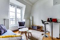 living area with comfortable blue sofa