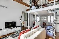 modern living area, dining area, kitchen, bedroom, and bathroom in a 1-bedroom loft Paris luxury apa