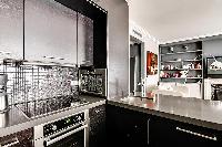 well-equipped kitchen in a 2-bedroom paris luxury apartment