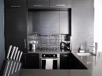 well-equipped kitchen in a 2-bedroom paris luxury apartment