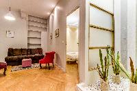 contemporary living area with golden brown velevet sofa and colorful velvet chairs  in Paris luxury 