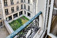 relaxing inner courtyard in a 3-bedroom Paris luxury apartment