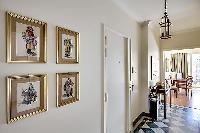 work of arts hanging on the white wall in Paris luxury apartment