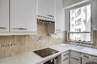 well-equipped kitchen in Paris luxury apartment