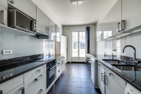 well-equipped kitchen in a 2-bedroom Paris luxury apartment