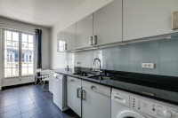 well-equipped kitchen in a 2-bedroom Paris luxury apartment