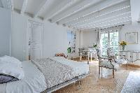 crisp and clean bedroom linens in Notre Dame - Colbert Suite luxury apartment