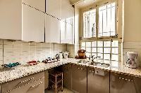 well-equipped kitchen in a 1-bedroom Paris luxury apartment