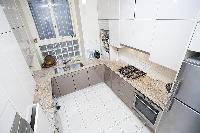 well-equipped kitchen in a 1-bedroom Paris luxury apartment