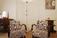 2 armchairs  in a 1-bedroom Paris luxury apartment
