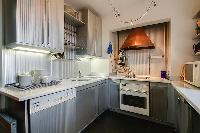 well-equipped kitchen in a 3-bedroom Paris luxury apartment