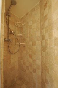 bathroom with shower in a 2-bedroom Paris luxury apartment