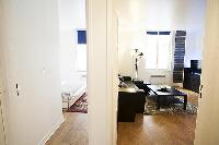 cozy living area and bedroom in a 1-bedroom Paris luxury apartment
