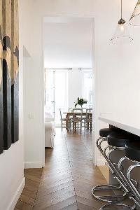 classy dining area, breakfast bar and stools in Paris luxury apartment