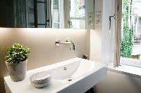 sink and mirror in a Paris luxury apartment