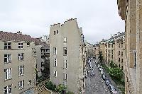 street view from the Frenchwindows of a 3-bedroom Paris luxury apartment