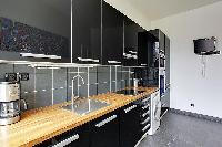 fully-equipped kitchen in a 3-bedroom Paris luxury apartment