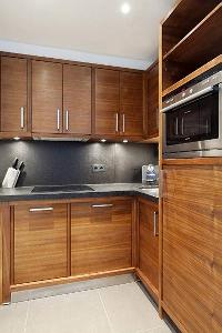 well-equipped kitchen in a  studio Paris luxury apartment