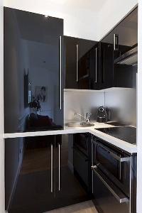 well-equipped kitchen in a  studio Paris luxury apartment