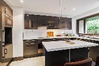 well-designed and well-equipped kitchen in a 4-bedroom Paris luxury apartment