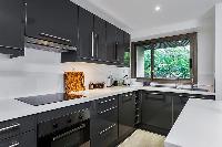 well-designed and well-equipped kitchen in a 4-bedroom Paris luxury apartment