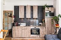 space-efficient kitchen in a 1-bedroom Paris luxury apartment