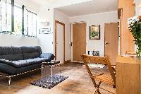 spacious living area and dining area in Paris luxury apartment