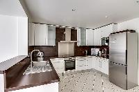 well-equipped kitchen in a 3-bedroom Paris luxury apartment