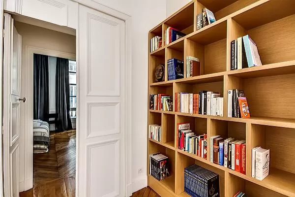bookshelves in a 3-bedroom Paris luxury apartment