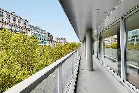 wraparound balcony with access to the living area and dining area with stunning view the Eiffel Towe