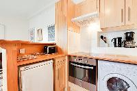 equipped kitchen in a 1-bedroom Paris luxury apartment