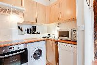 equipped kitchen in a 1-bedroom Paris luxury apartment