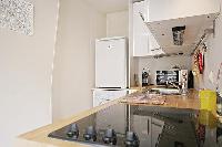 well-equipped kitchen in a 1-bedroom Paris luxury apartment