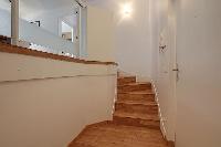 wooden stairs in a 2-bedroom Paris luxury apartment