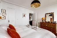 crisp and clean bedroom linens in Passy - Trocadero I luxury apartment