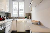 A compact kitchen in a 2-bedroom paris luxury apartment