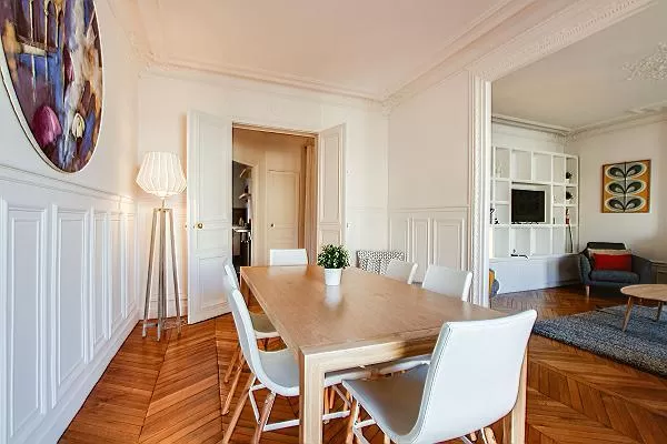 chic dining set for six with accessto the living area and kitchen in a 2-bedroom paris luxury apartm